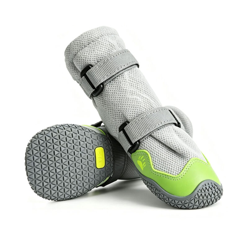 Anti-slip rubber sole boots in neon lime displaying the deep multi-terrain traction tread grid on the bottom base.