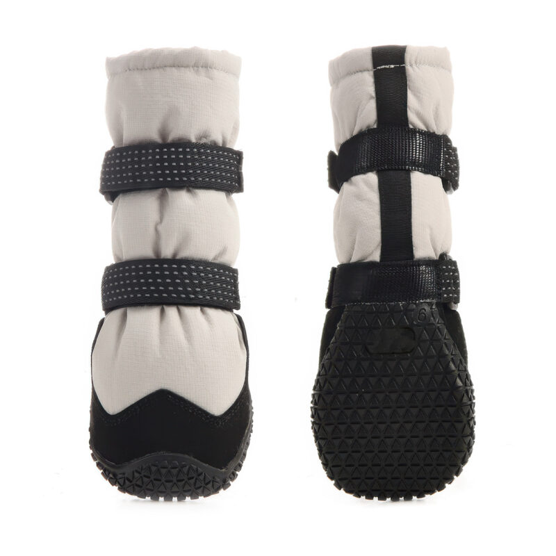 Front and rear view of anti-slip rubber sole boots in silver gray showcasing the deep multi-terrain tire tread base grid.