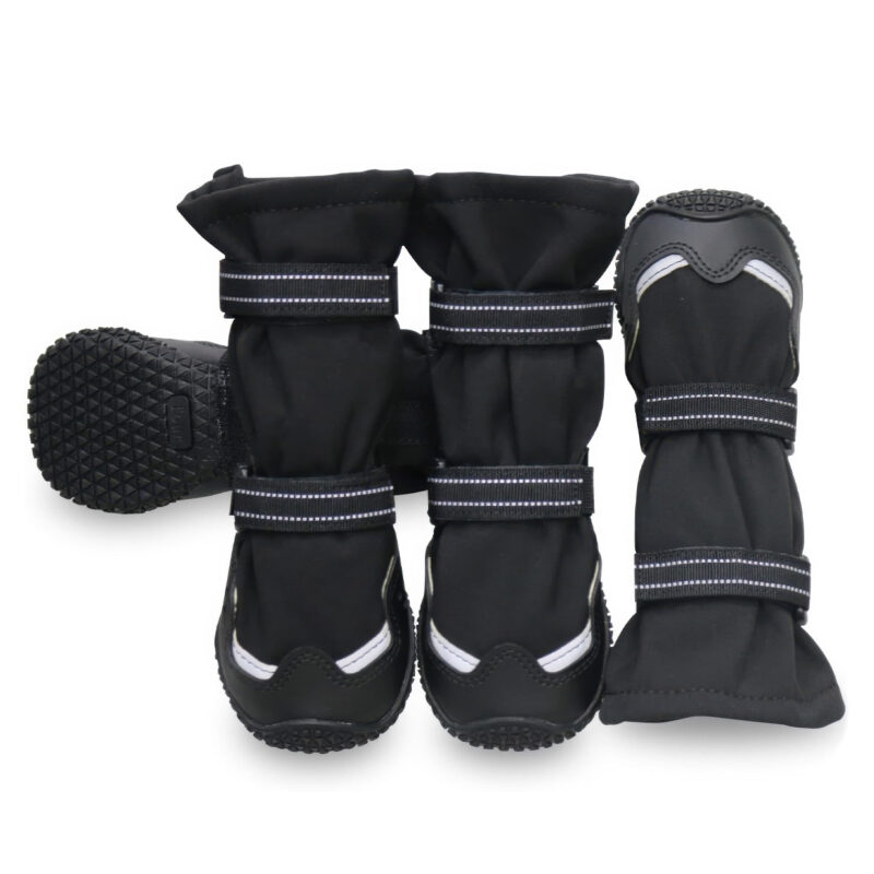 Anti-Slip Rubber Sole Boots Dense Tread Detail Detailed tread matrix on anti-slip rubber sole boots alongside black fleece lined winter booties on a white background.