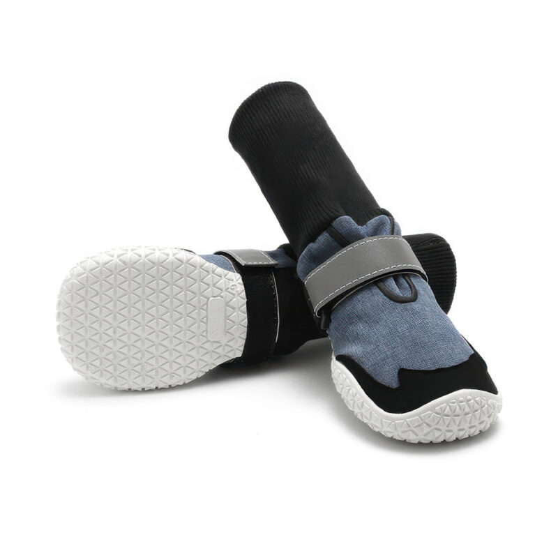 Anti-slip rubber sole boots in denim blue displaying the dense triangular traction grid on the white base.