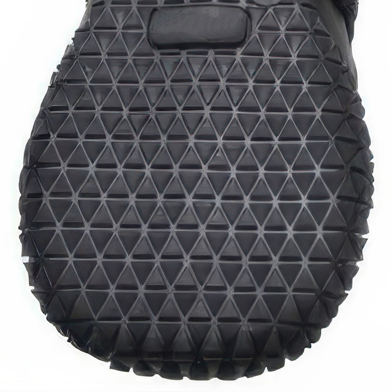 Wear-resistant anti-slip rubber sole boots displaying a deep triangular traction pattern for ice safety.