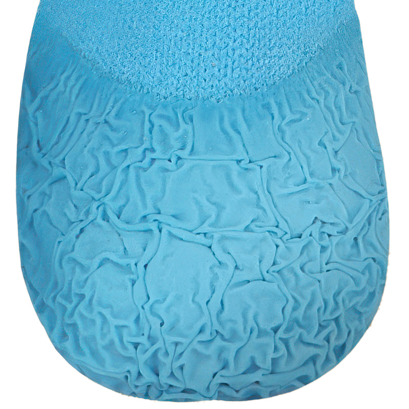Macro front view showcasing the high-friction wrinkled rubber base tread on anti-slip textured dog socks.