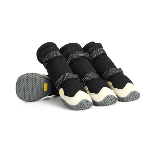 Premium breathable mesh dog boots in black and cream featuring four structured booties with non-slip rubber soles.
