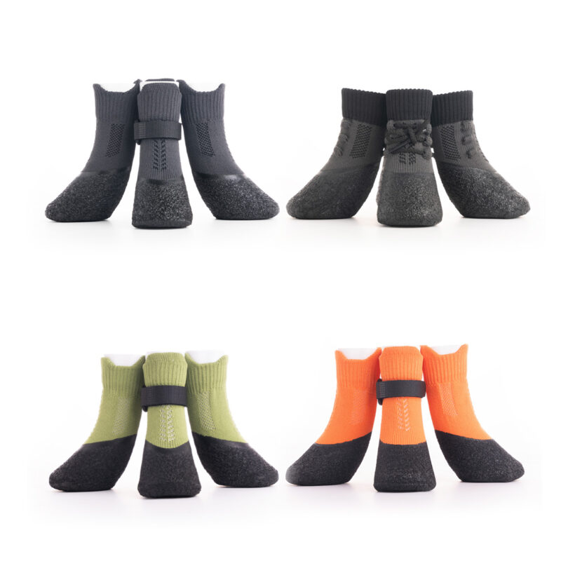 Four color choices of breathable mesh dog socks showing the lace-up and velcro buckle variants side-by-side.
