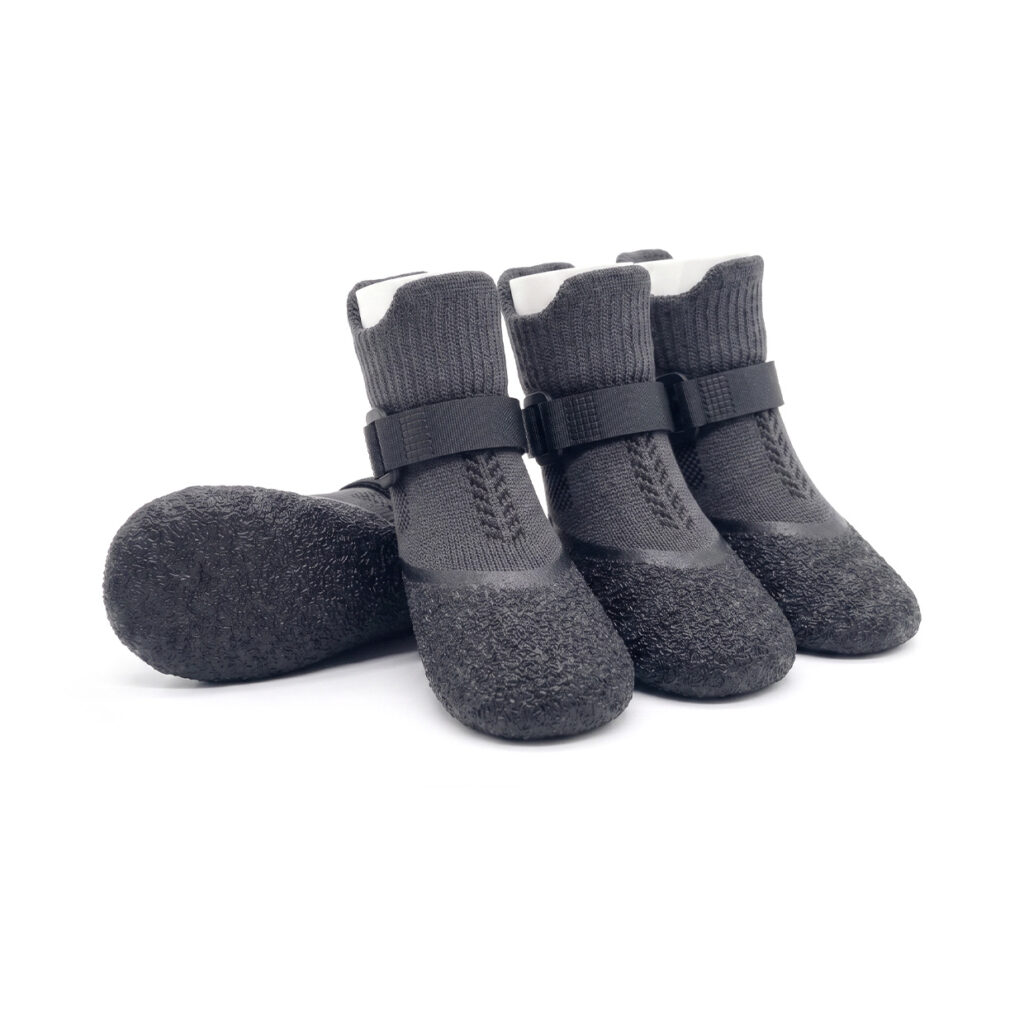 Silver gray breathable mesh dog socks with black rubber dipped crinkle soles and secure velcro straps.