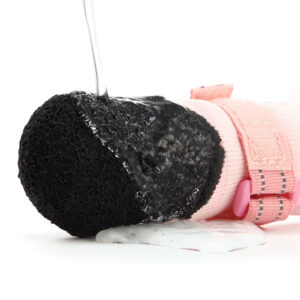 Water pour test demonstrating the seamless waterproof protective latex base of breathable outdoor paw protectors.