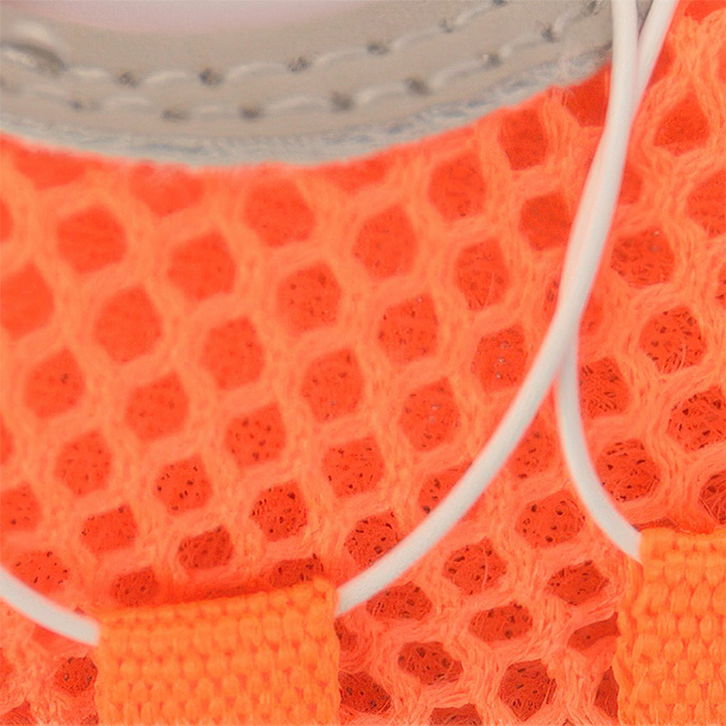 Macro view focusing on the high-airflow open cell sandwich mesh upper fabric and wire lace routing on an orange boot.