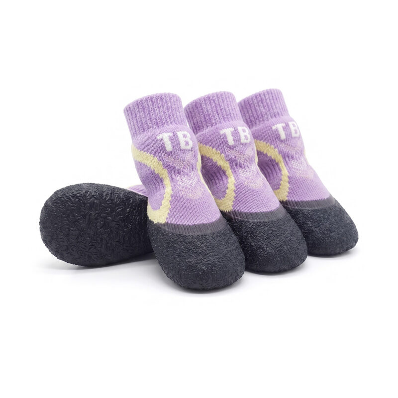 Taro purple crinkle grip knit booties displaying cream contrast accent panels and a flexible black vulcanized sole.