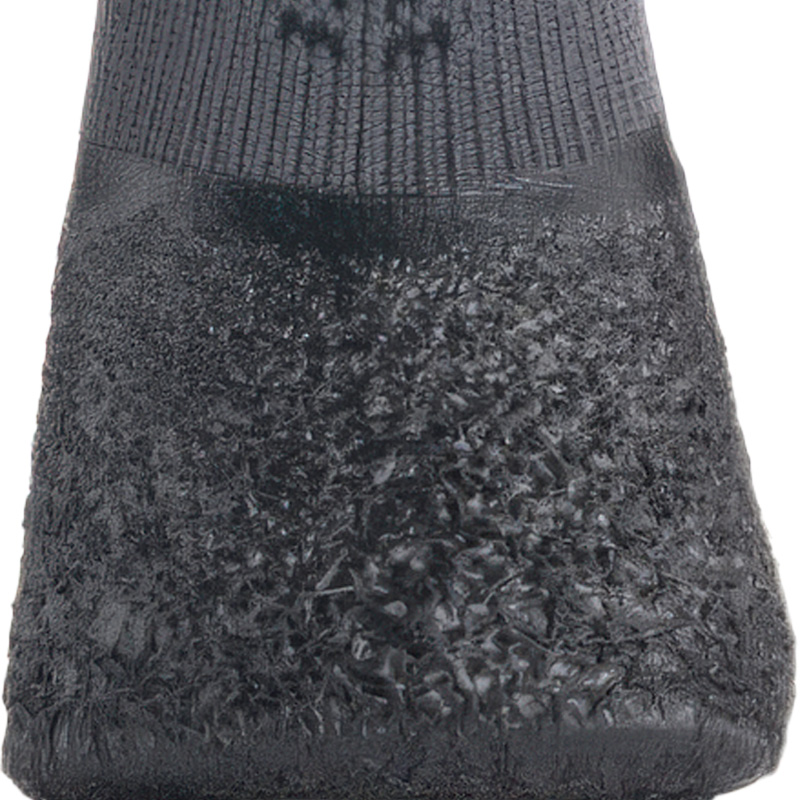 Macro view highlighting the seamless waterproof transition boundary on crinkle sole knit dog booties.