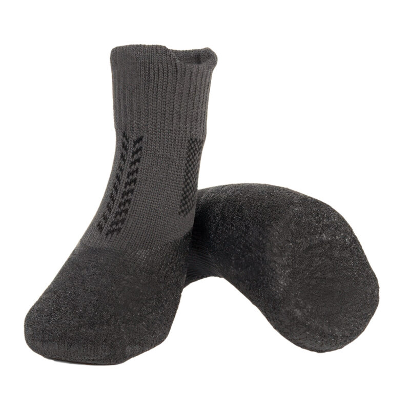 A pair of silver gray crinkle sole knit dog booties displaying the seamless waterproof latex dip boundary.