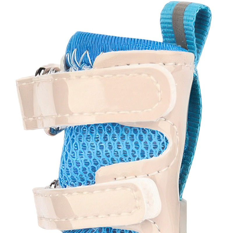 Technical close up of dog shoes that stay-on featuring dual layer patent leather panels and reflective gray safety piping.
