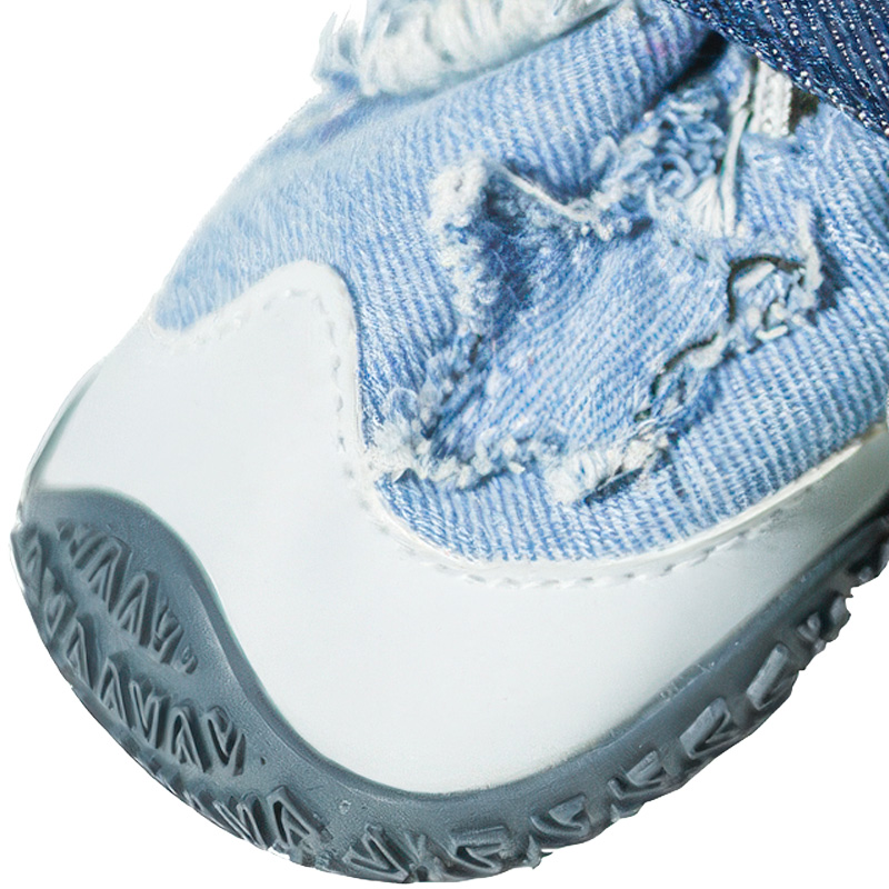 Front angle view of dog shoes that stay-on detailing the white scuff resistant PU toe shield and rubber wrap.