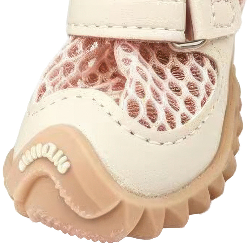 Front angle macro of dog shoes that stay-on detailing the flexible rubber toe guard and robust perimeter stitching.