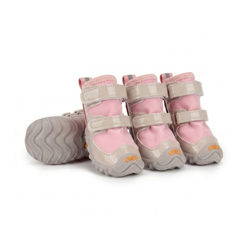 Blush pink double-Velcro-strap dog shoes showing the secure wrap around ankle closure and glossy protective trim.