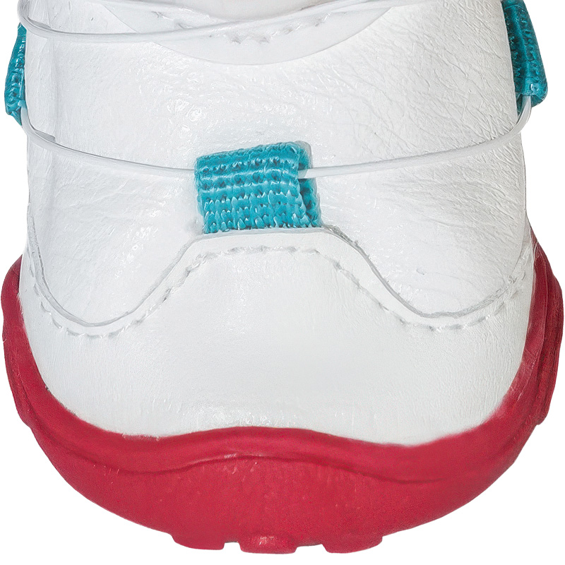 Technical close up of easy-on-off dog shoes showing stitched micro wire loops and embossed PU panels.
