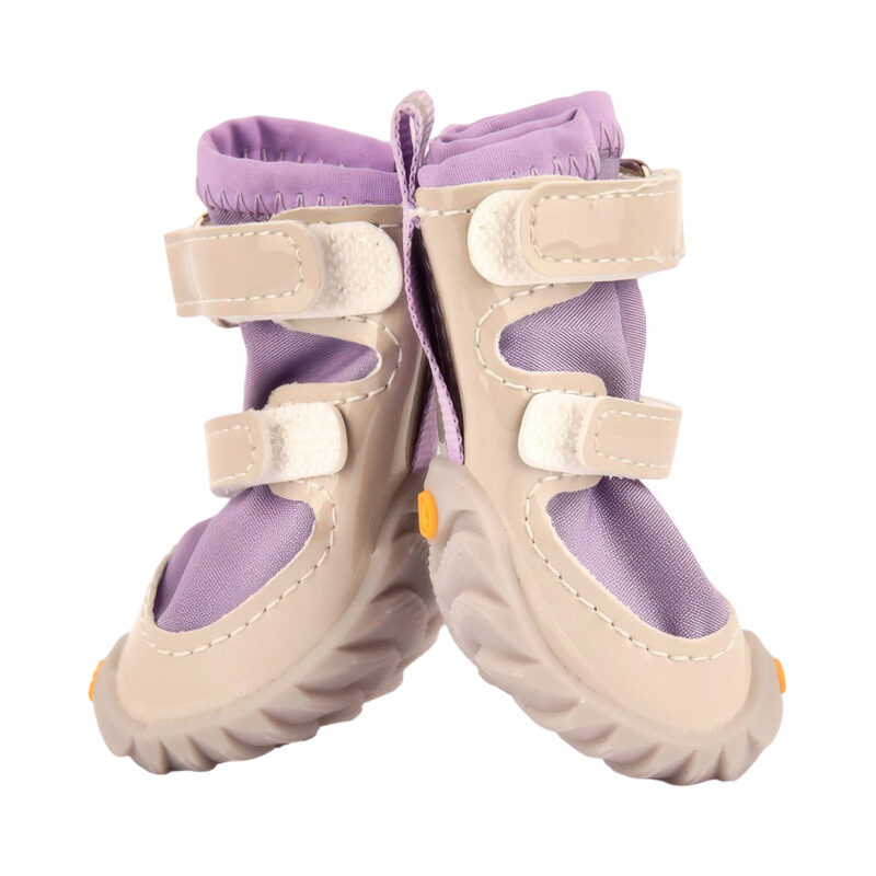 Close up view of easy-on-off dog shoes in taro purple showcasing the reflective silver lines and wide gusset opening.