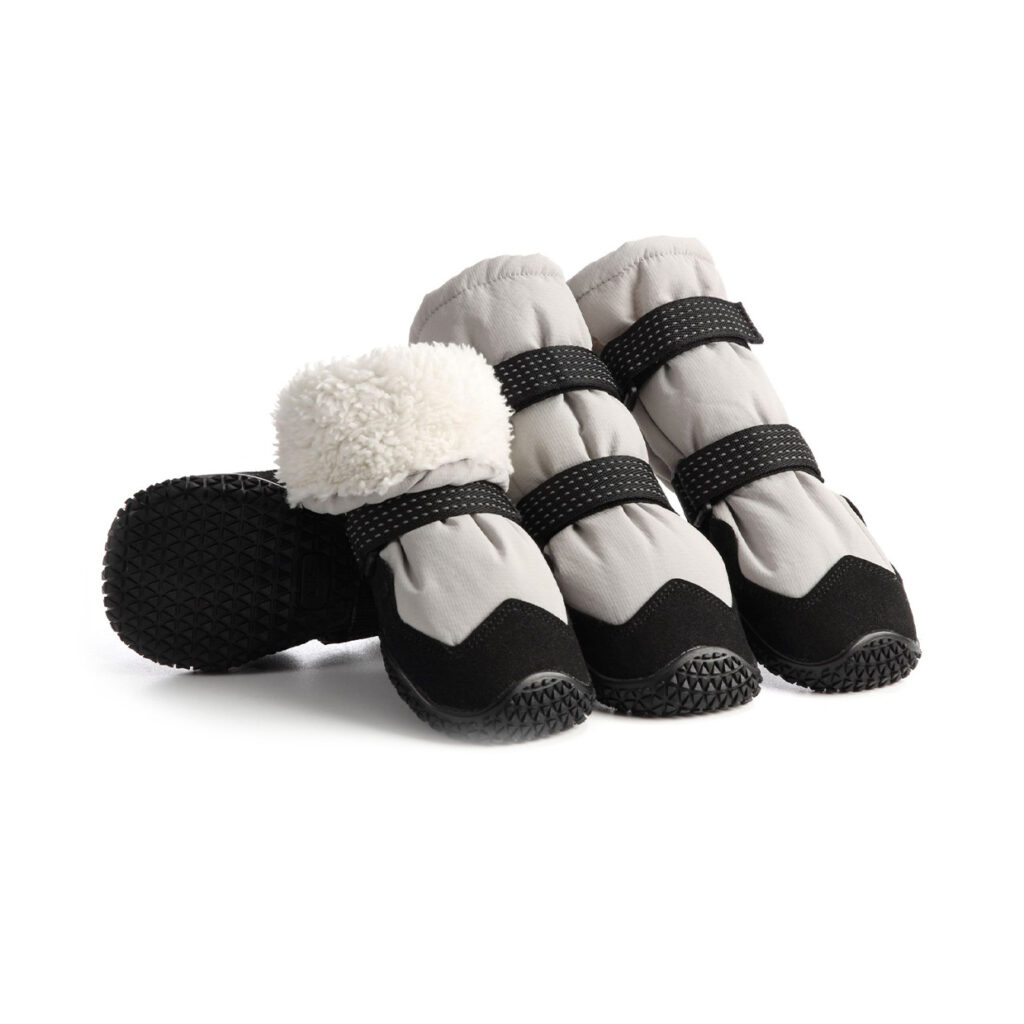 Fleece-lined dog boots in silver gray showing four winter booties with thick white plush lining and black rubber outsoles.