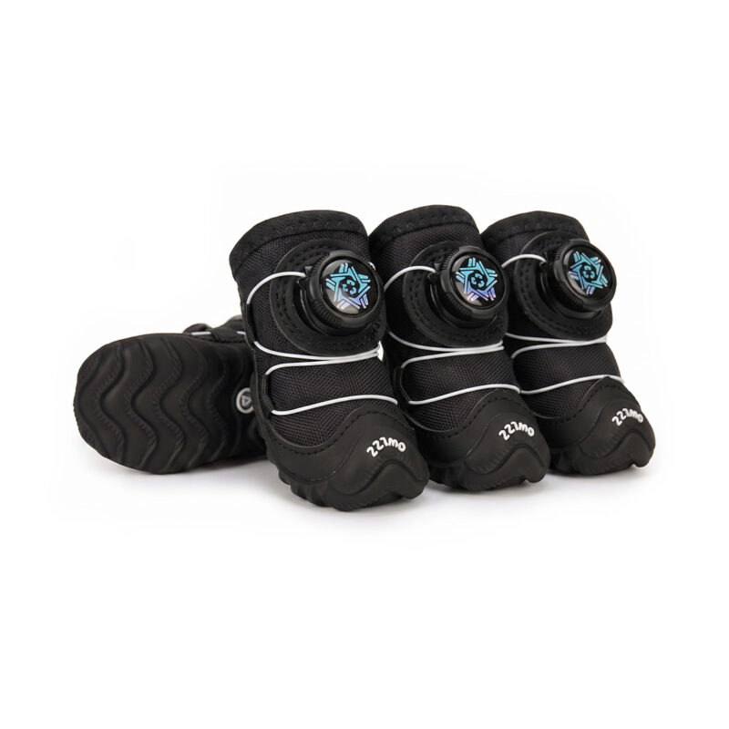 Stealth black fleece lined dog shoes featuring dark weather-resistant frames and matching black wire adjustment dials.