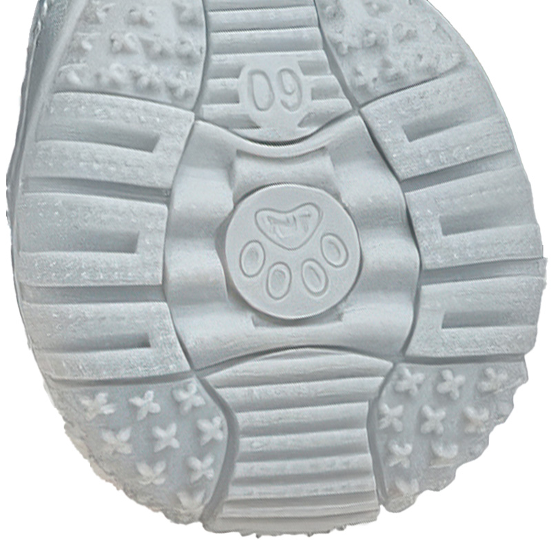 Flexible rubber sole boots showing the soft tendon compound outsole matrix with a molded central paw insignia.