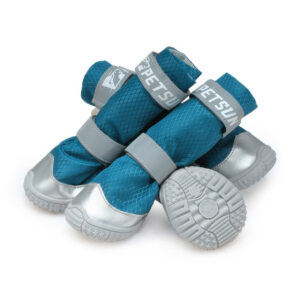 Flexible rubber sole boots in ocean teal displaying the deep multi-terrain traction tread grid on the bottom base.
