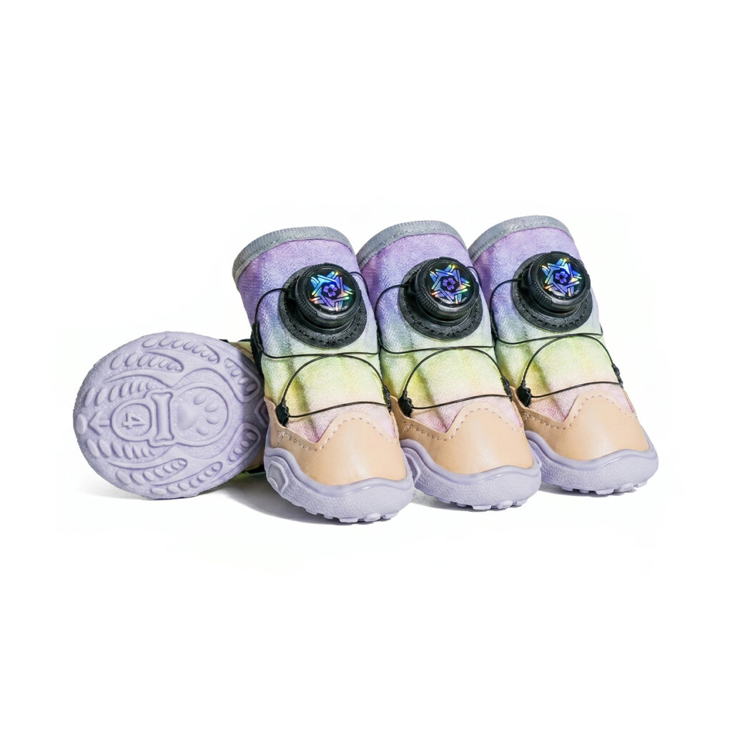 Unicorn pink gradient dial-fit dog shoes showing the mechanical cable wheel and light lavender non slip rubber soles.