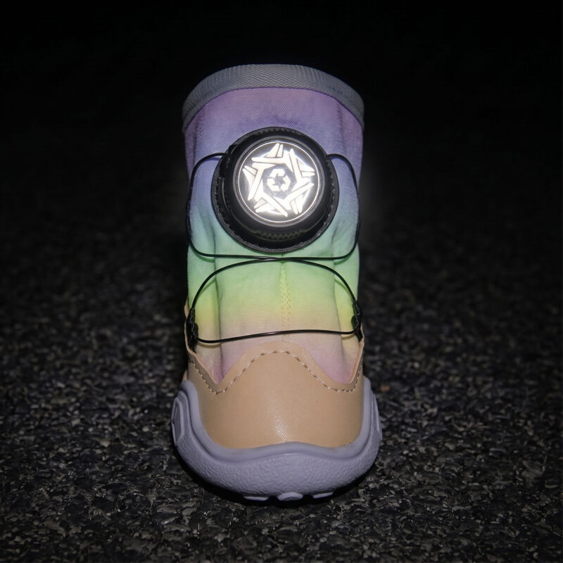 Dark Room Photo Luminescent Luminous Fabric Visibility Test Gradient dial-fit dog shoes in darkness emitting a high visibility bright neon glow around the central dial frame.
