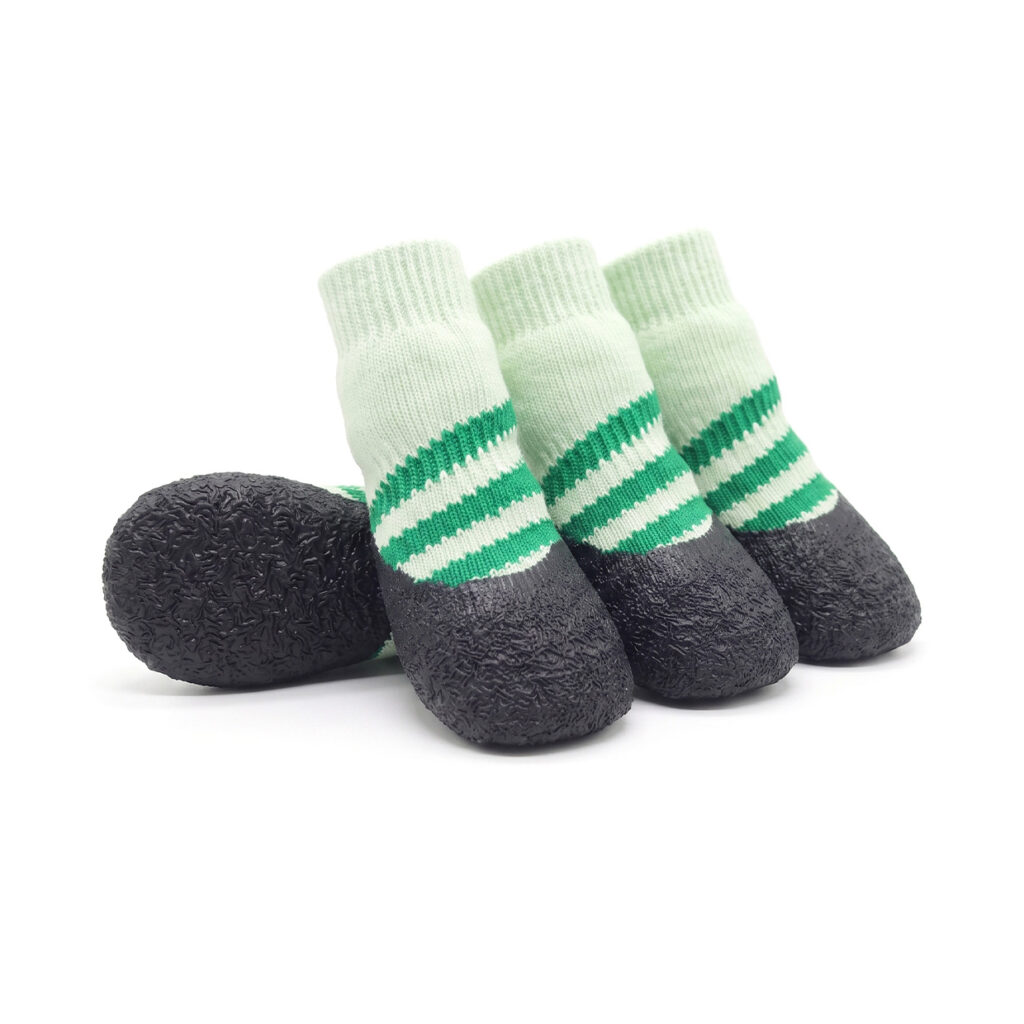 Sage green hardwood floor dog socks with striped knit accents and a seamless black non-slip rubber base.