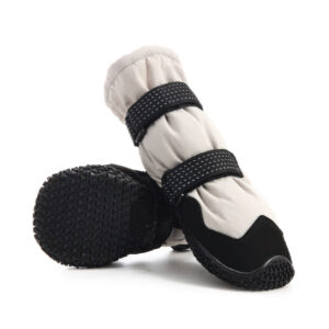Heavy duty outdoor dog boots showcasing the unyielding automotive tire pattern matrix on the flexible rubber base.