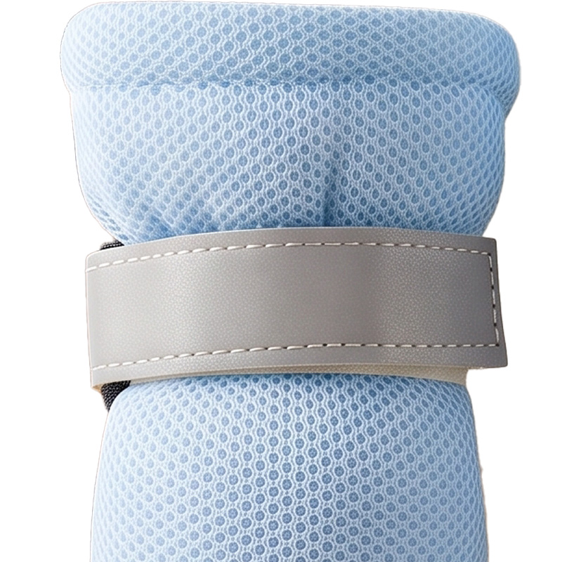 Close-up of the wide retroreflective top closure strap on high-top dog boots for large dogs.