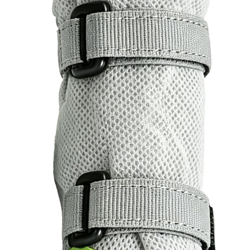 Double hook-and-loop wrap adjustment bands on grey high-top outdoor dog boots minimizing material bulk.