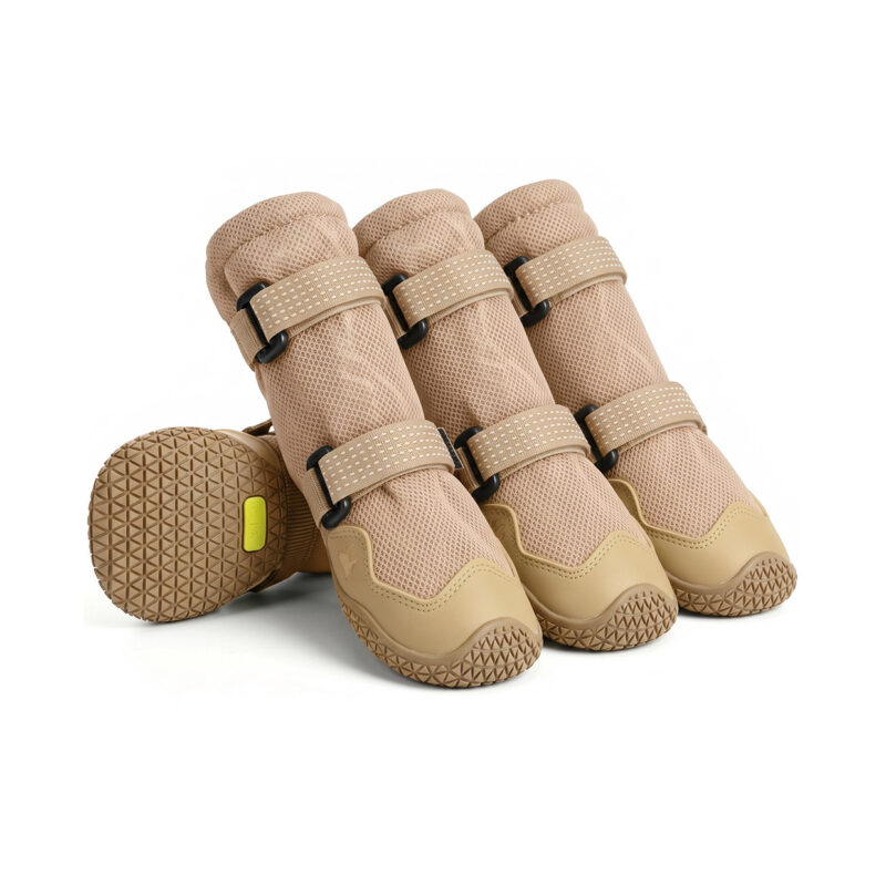 High-top outdoor dog boots in khaki tan displaying double adjustment magic straps and premium leather toe boxes.