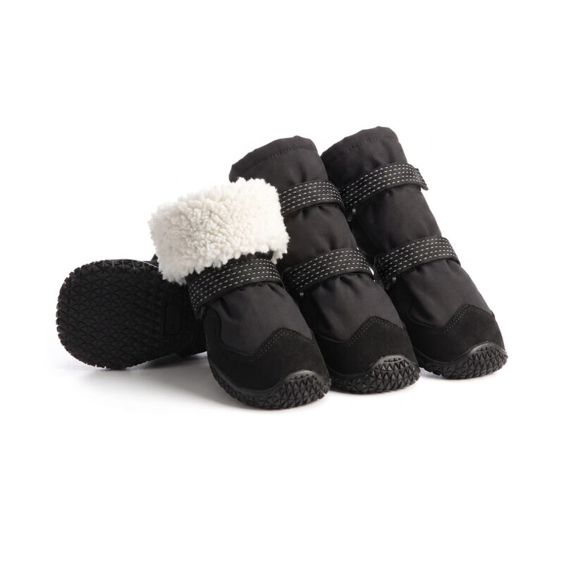High-top warm dog boots in stealth black displaying a thick white Arctic fleece cuff lining and durable protective toe caps.
