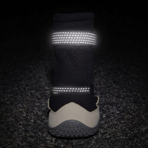 Dual-sided High-visibility Safety Reflective Webbing for Secure Night Outdoor Walking Retroreflective straps on protective hiking dog boots glowing bright under night light conditions.