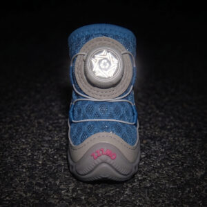 High Visibility Night Safety Reflective Dial Glow Front view of a blue honeycomb mesh dog shoe with its white circular mechanical dial face glowing under darkness.