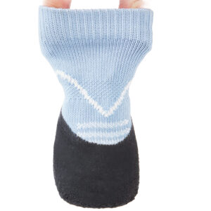 Fingers testing the structural elasticity of sky blue lightweight knit dog socks to demonstrate cuff resilience.