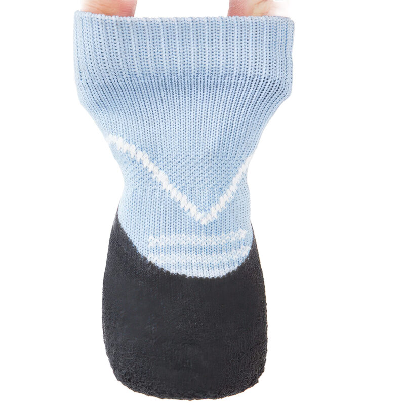 Fingers testing the structural elasticity of sky blue lightweight knit dog socks to demonstrate cuff resilience.
