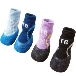 An organized multi-pack of no-noise indoor dog socks illustrating the integrated leakproof rubber cup wrap.