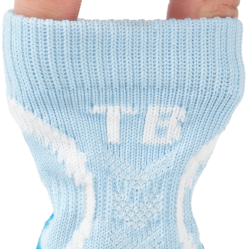 Fingers expanding the high-stretch rib collar of sky blue no-slip stay-on dog socks to demonstrate elastic tension.
