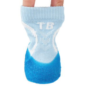 Fingers expanding the high-stretch rib-knit collar of sky blue no-slip stay-on dog socks to demonstrate elastic tension.