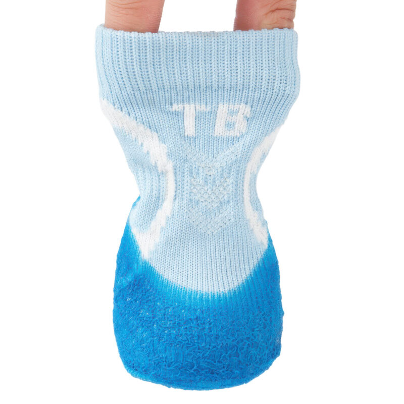 Fingers expanding the high-stretch rib-knit collar of sky blue no-slip stay-on dog socks to demonstrate elastic tension.