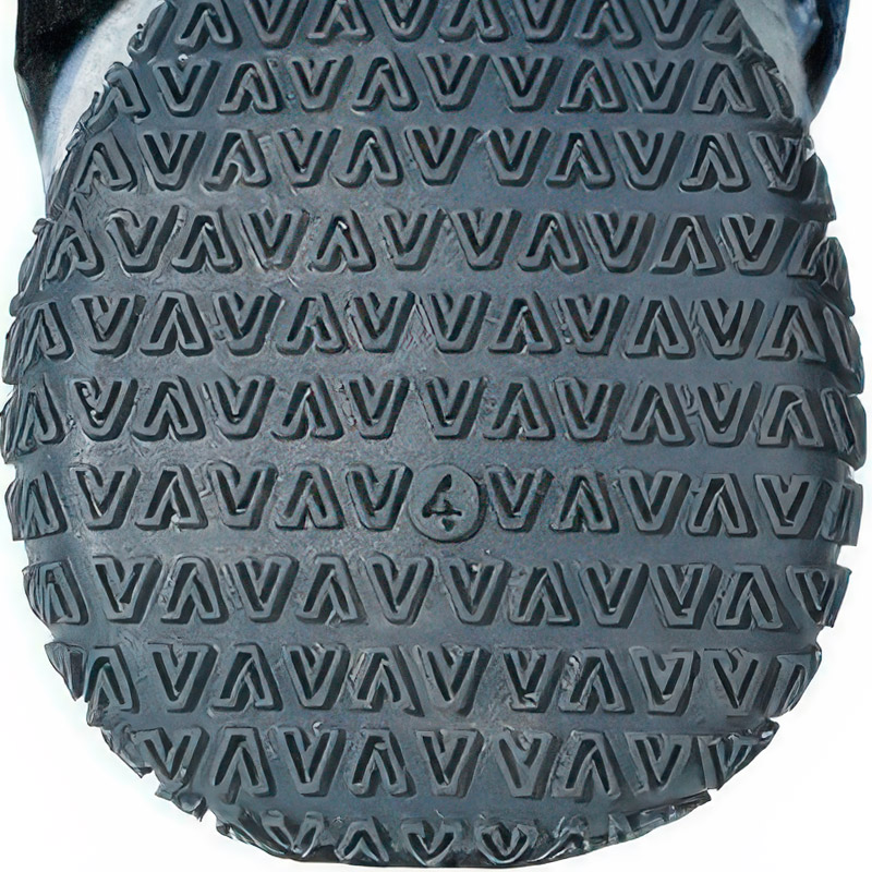 Bottom macro of outdoor dog shoes with rubber sole highlighting the geometric anti slip chevron patterns.