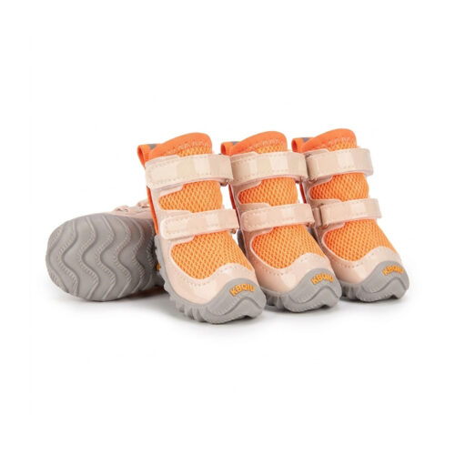 Tangerine orange patent leather dog shoes with double Velcro straps and breathable black mesh uppers.