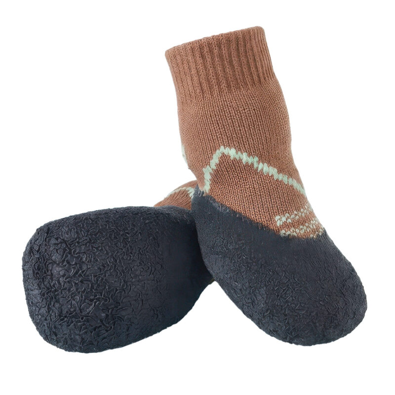 A detailed close-up showing the micro-grooved grip texture on the lower footbed of mocha brown paw protection dog socks.