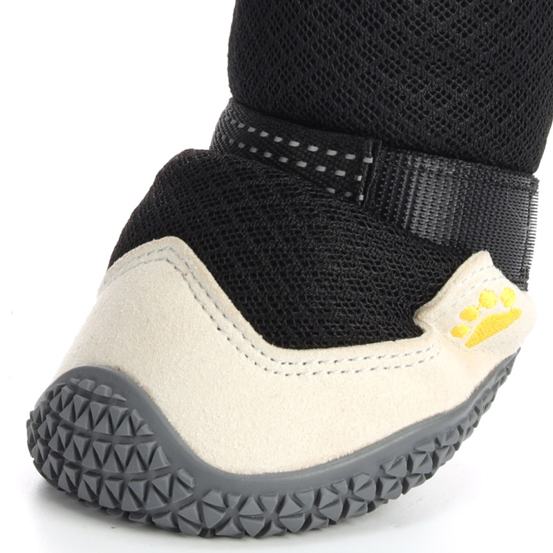 Close-up of microfiber leather toe cap on protective hiking dog boots for claw scratch protection.