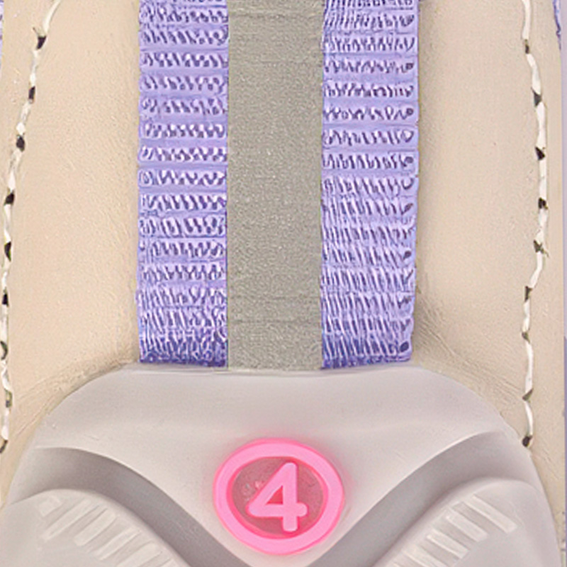 Rear perspective highlighting the vertical silver retroreflective safety ribbon sewn down the spine of a purple dog shoe cuff.
