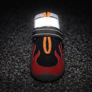 High Contrast Retroreflective Silver Band Night Safety Visibility Test Crimson red pet bootie close up under dark exposure demonstrating the intense silver light flash of the reflective band.
