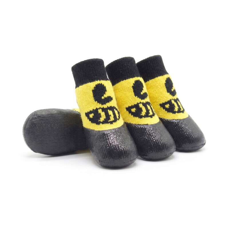 Cartoon style lemon yellow rubber dipped dog socks with black protective bottoms for small to medium dogs.