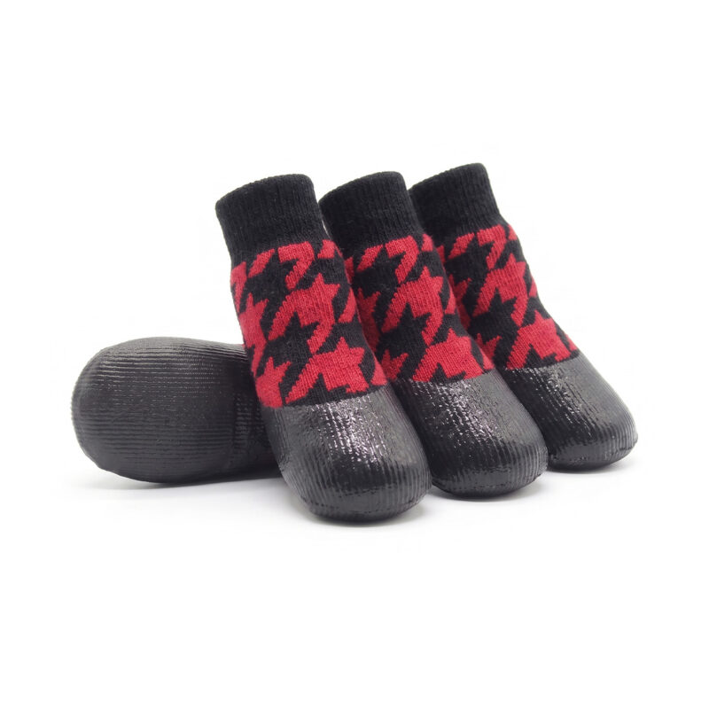 Houndstooth patterned black and red rubber dipped dog socks with protective non-slip latex soles.
