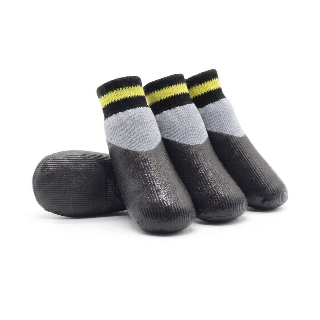 Silver gray rubber dipped dog socks featuring black latex bottoms and yellow accent stripes.
