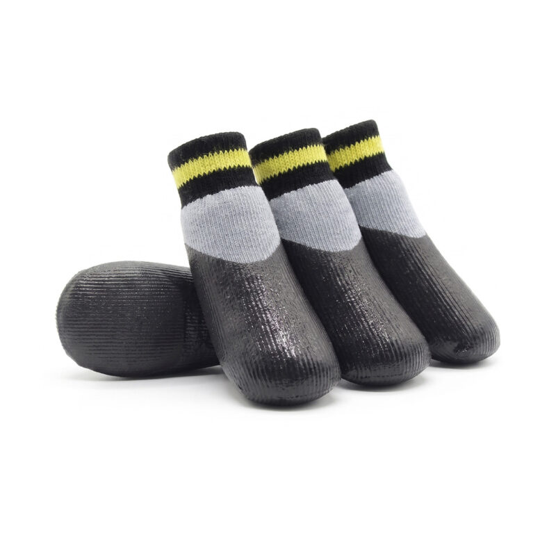 Silver gray rubber dipped dog socks featuring black latex bottoms and yellow accent stripes.